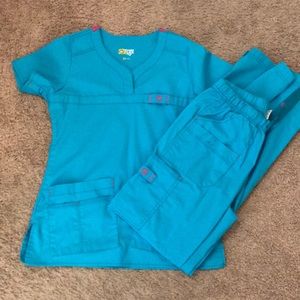 Wonder Wink turquoise and pink scrub set